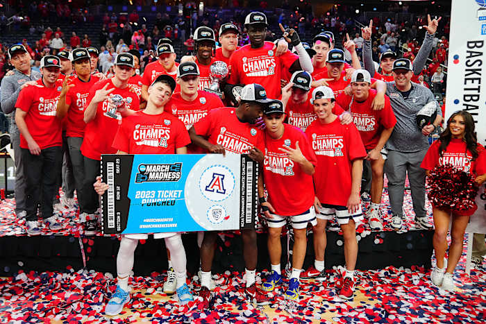 The Arizona Wildcats celebrate after winning the conference championship.